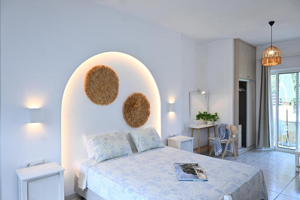 Łóżko lub łóżka w pokoju w obiekcie Marika Studios & Apartments