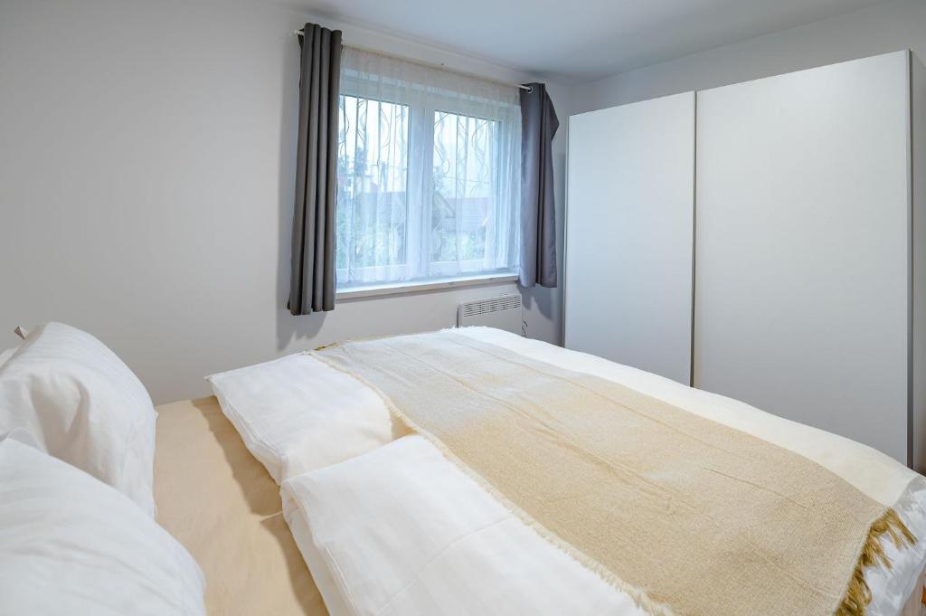 Postel nebo postele na pokoji v ubytování Apartma na hribu