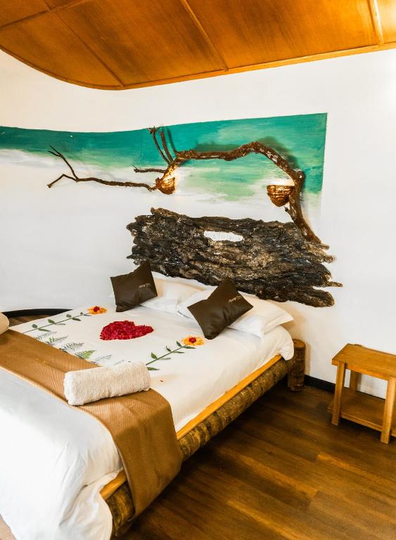 Postel nebo postele na pokoji v ubytování RISING SUN BEACH VIEW