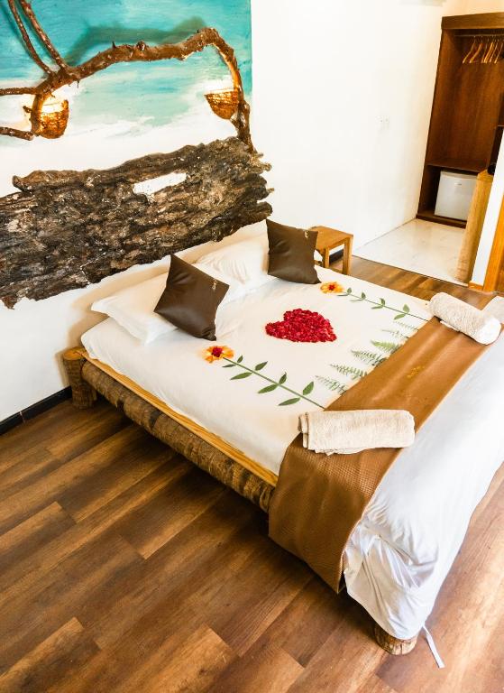 Postel nebo postele na pokoji v ubytování RISING SUN BEACH VIEW
