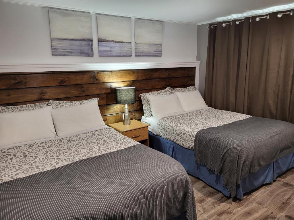 Postel nebo postele na pokoji v ubytování Scoodic Motel