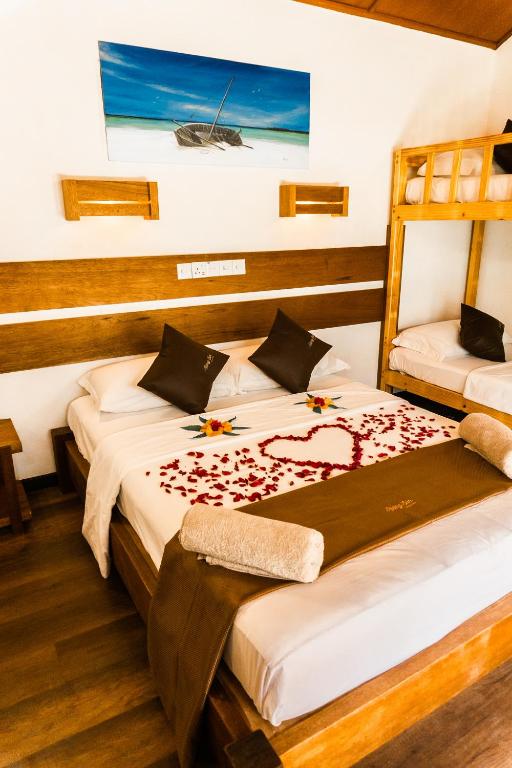 Postel nebo postele na pokoji v ubytování RISING SUN BEACH VIEW