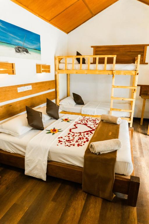 Postel nebo postele na pokoji v ubytování RISING SUN BEACH VIEW