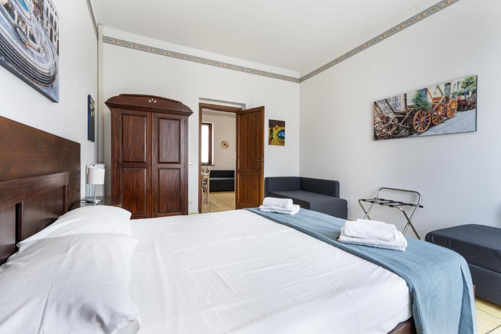 Łóżko lub łóżka w pokoju w obiekcie Porta Carini Residence
