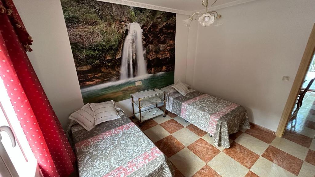Postel nebo postele na pokoji v ubytování Vivienda rural Saltos de la Osera