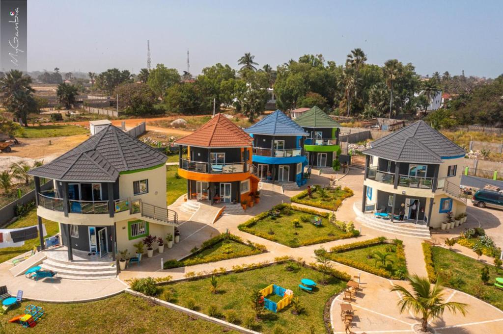 an aerial view of a house with a playground at Lovely 13-Bed Complex on Cape Point Beach Bakau in Bakau