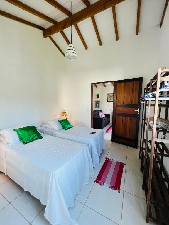 Uma cama ou camas num quarto em Pousada Pandoro