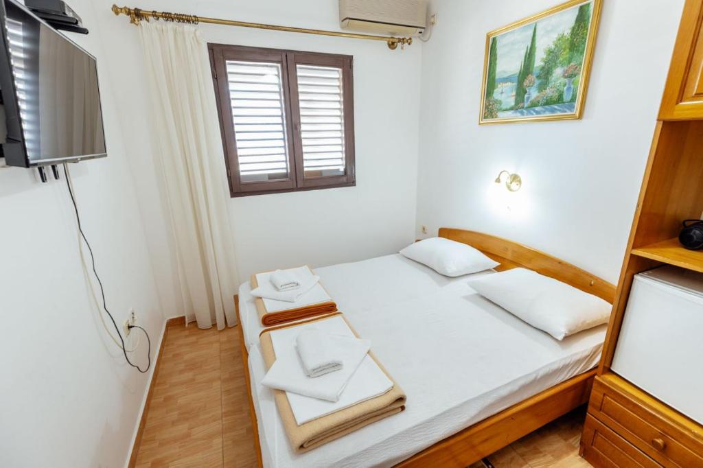 Postel nebo postele na pokoji v ubytování Radic Rooms