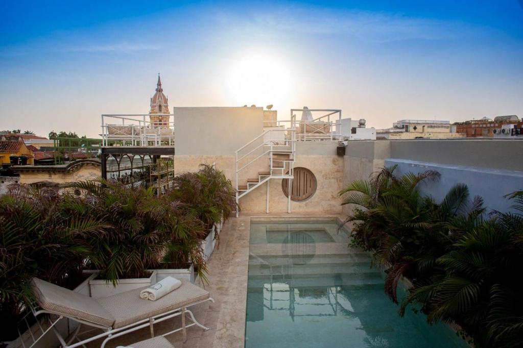 a swimming pool on the side of a building at Sol de Alba Hotel Boutique in Cartagena de Indias