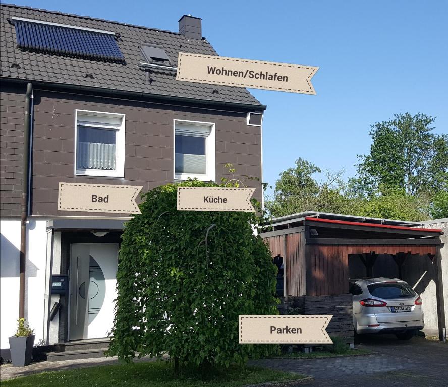 a house with signs on the front of it at Ferienwohnung A&K in Bottrop