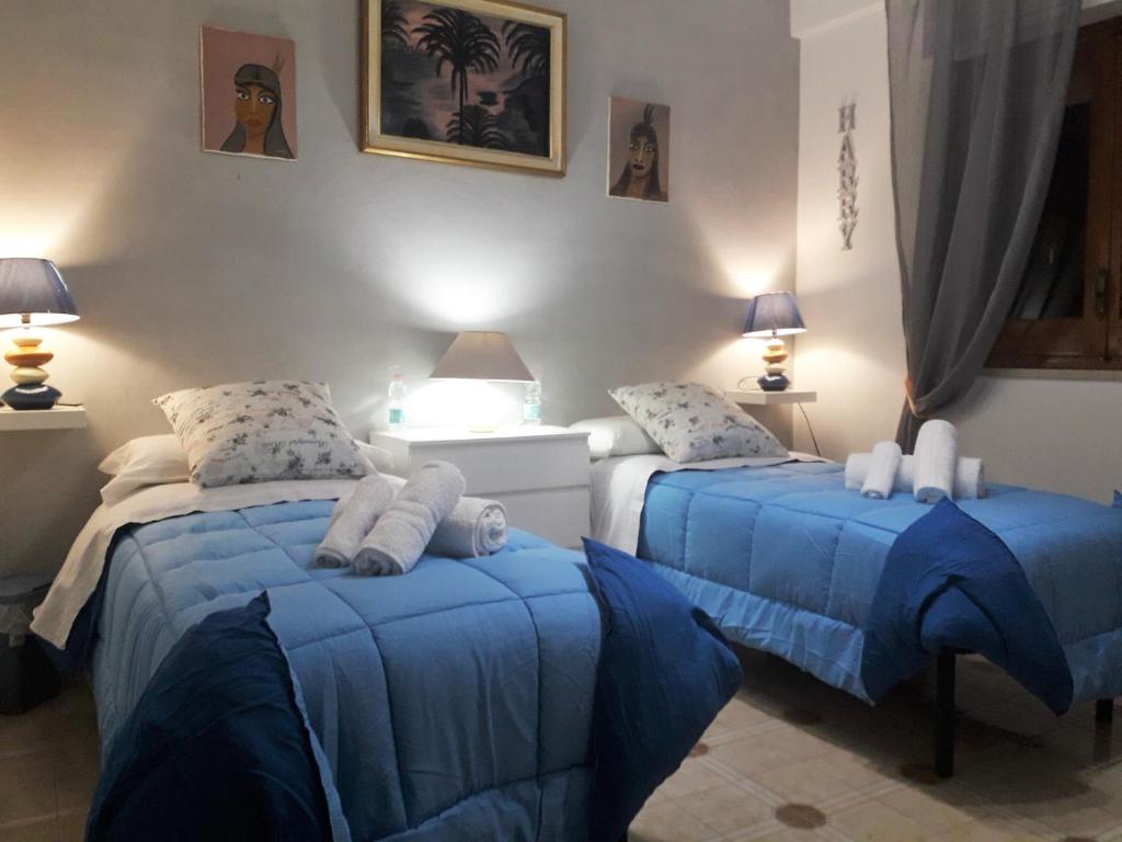 Łóżko lub łóżka w pokoju w obiekcie Casa Particular
