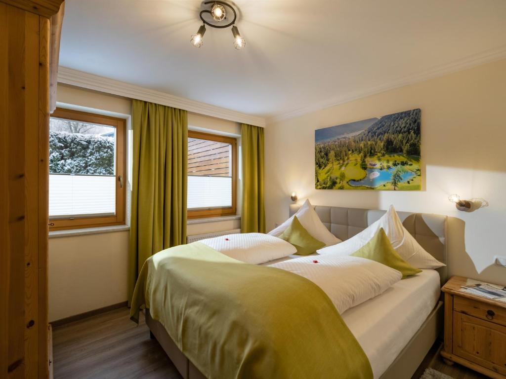 Postel nebo postele na pokoji v ubytování Appartements Fortuna