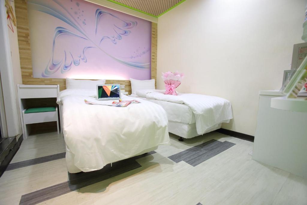 Postel nebo postele na pokoji v ubytování Clover house-自助式無人旅店