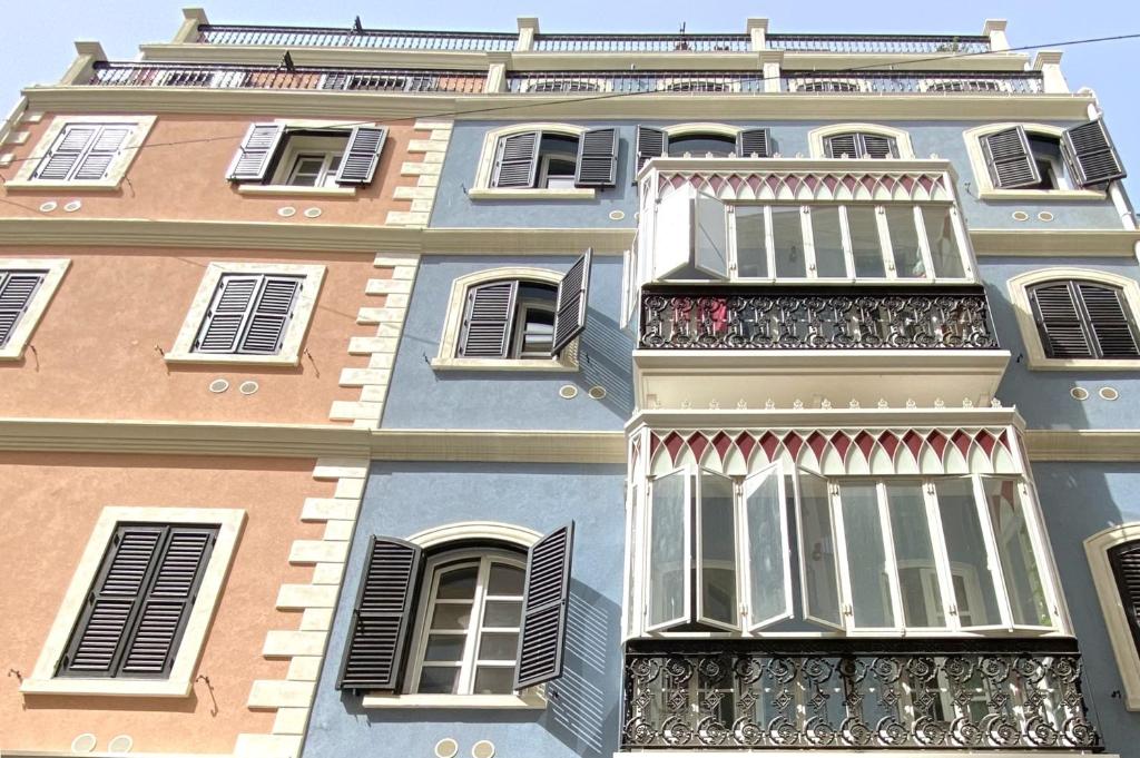 a tall building with a balcony in front of it at Stylish City Centre Studio - Grand Central House in Gibraltar