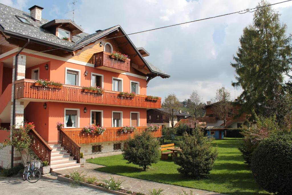 a house with balconies on the side of it at B&B La Ceresara in Asiago