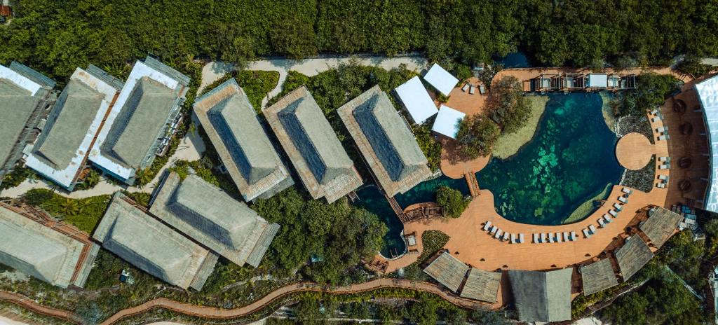 an overhead view of a park with a swimming pool at Hotel Shibari - Restaurant & Cenote Club in Tulum