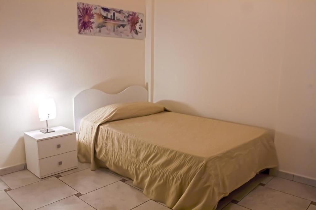 Een bed of bedden in een kamer bij Appartamento Ghalà