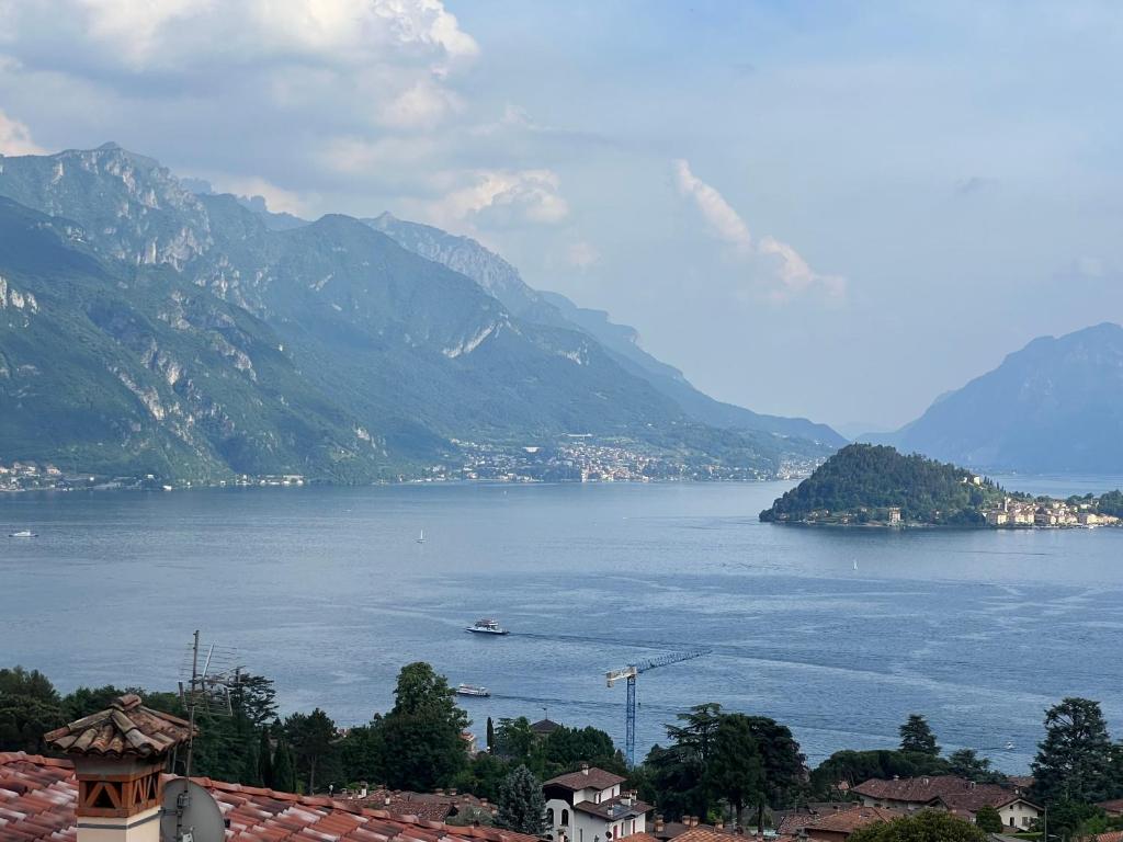 a view of a large body of water with mountains at Appartamento Arancione in Menaggio