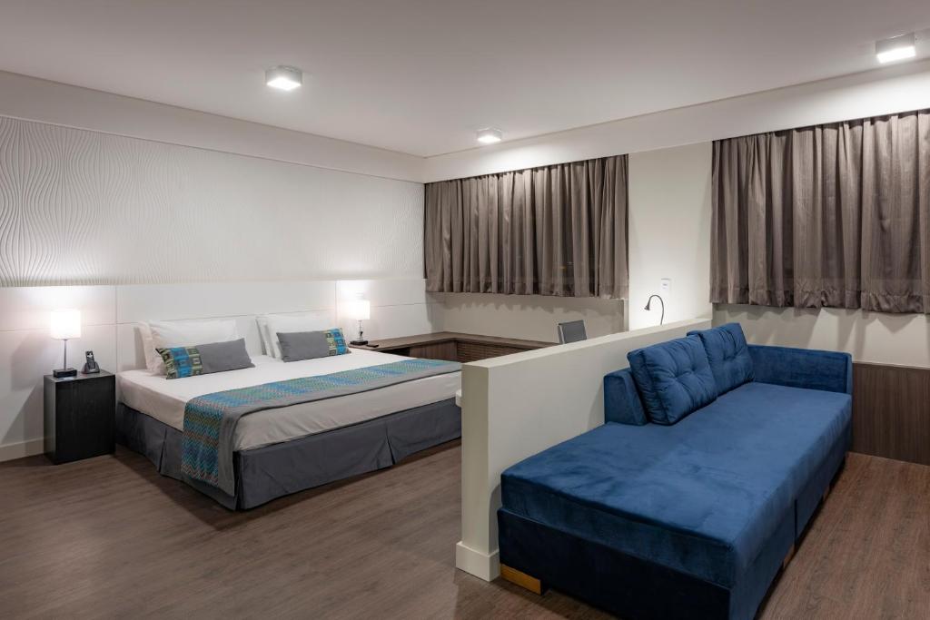 Uma cama ou camas num quarto em Monreale Plus Midtown Campinas