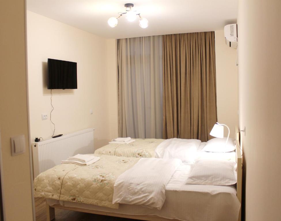 Postel nebo postele na pokoji v ubytování Nitsa Guest House