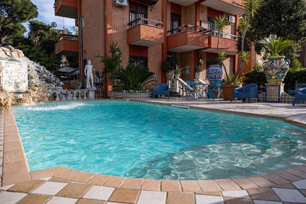 a swimming pool in front of a building at Casa Romana in Tor Vergata