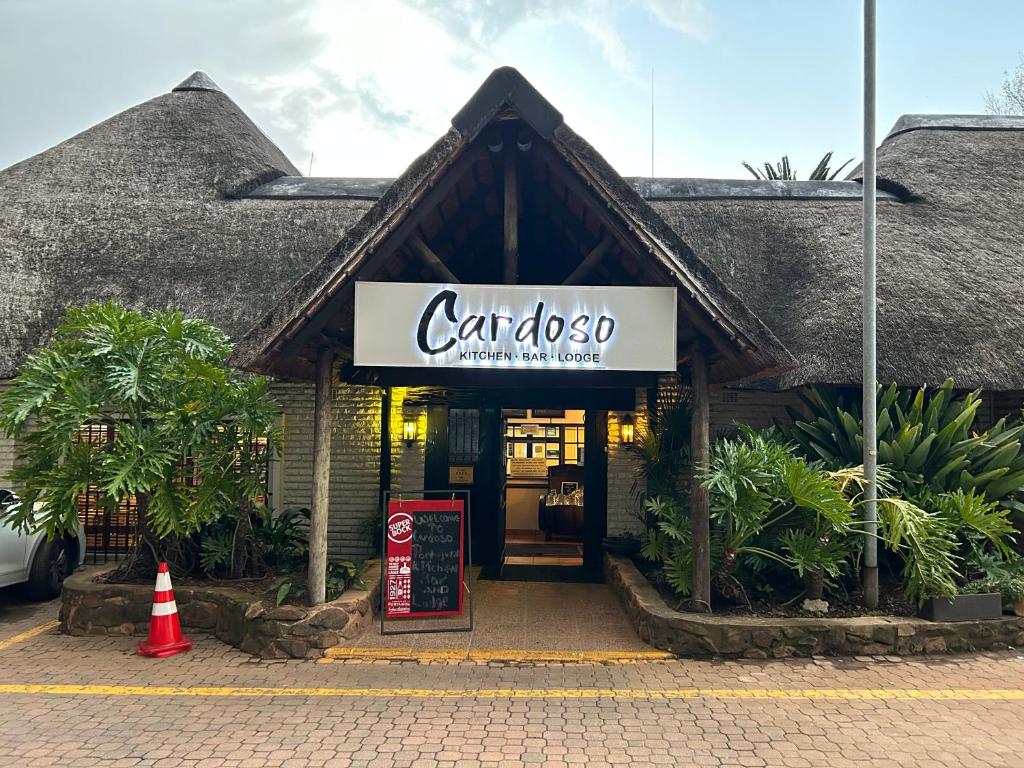 a building with a sign that reads car do so at Cardoso Kitchen Bar & Lodge in Johannesburg