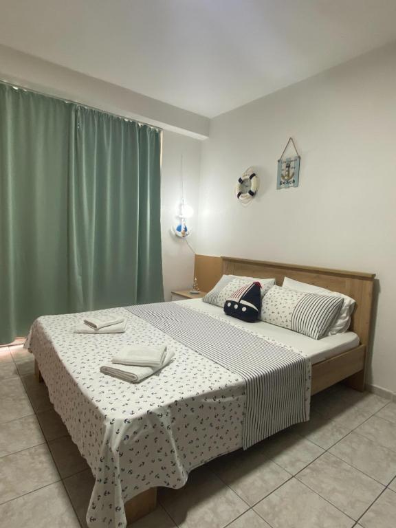 a bedroom with a bed with two towels on it at ANI Apartment in Ohrid