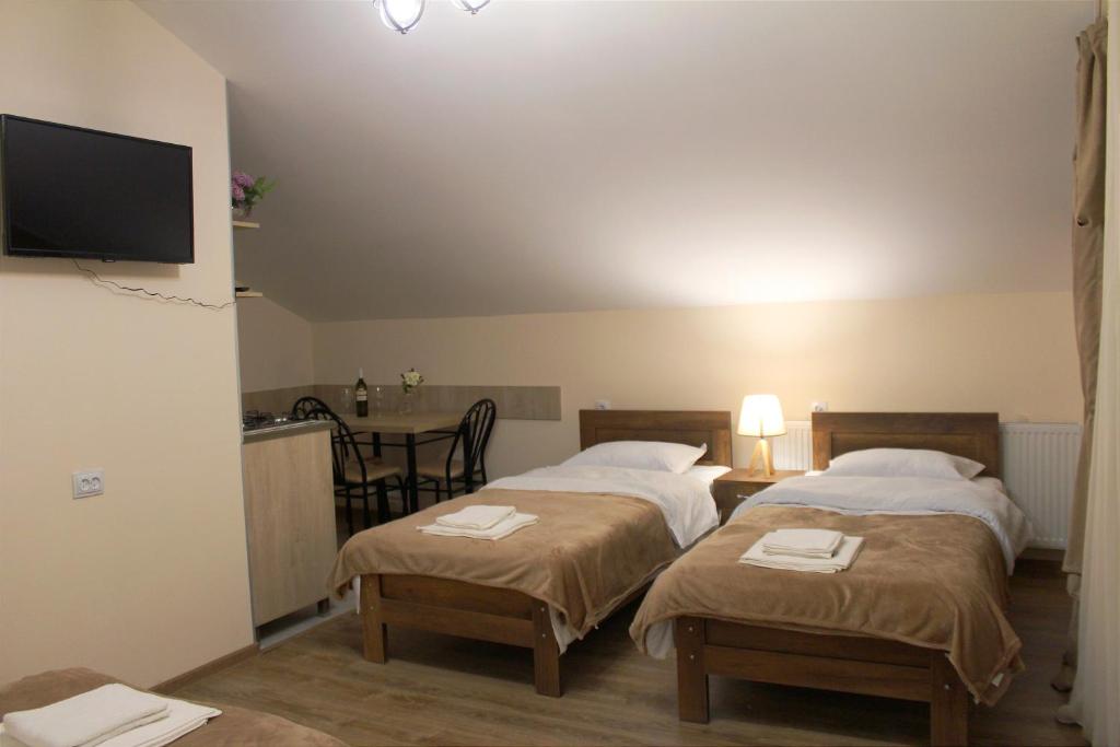 Postel nebo postele na pokoji v ubytování Nitsa Guest House
