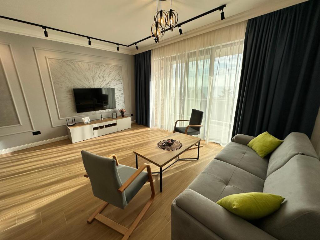 TV a/nebo společenská místnost v ubytování White Star Apartments