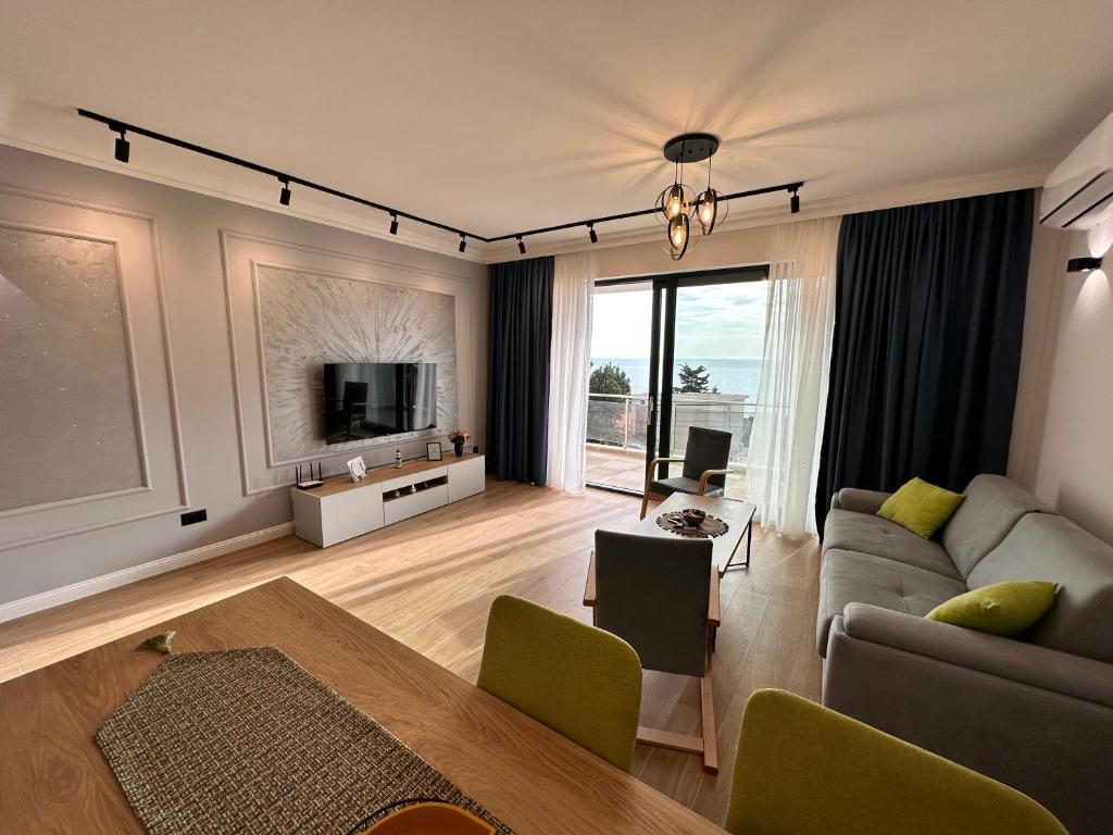 TV a/nebo společenská místnost v ubytování White Star Apartments