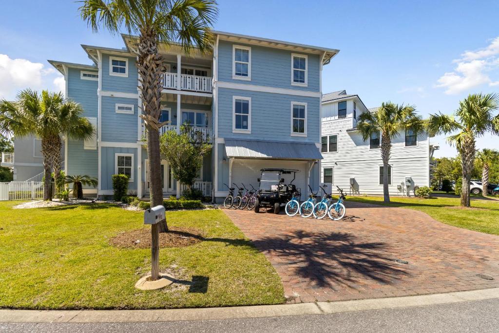 a blue house with bikes parked in front of it at Easy Breezy in Santa Rosa Beach