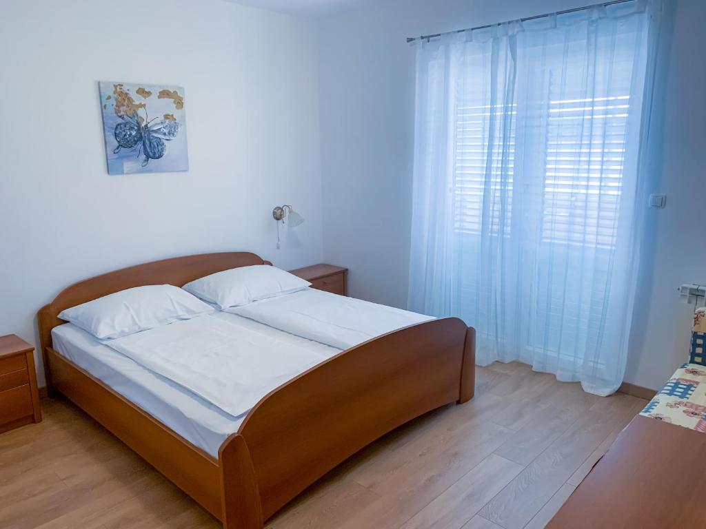Postel nebo postele na pokoji v ubytování Haus Lupić
