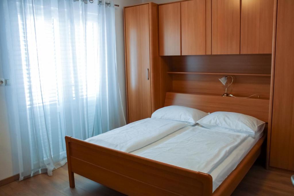 Postel nebo postele na pokoji v ubytování Haus Lupić