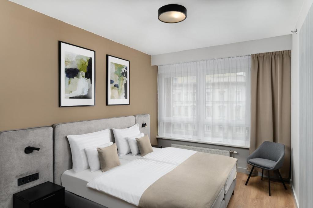 Postel nebo postele na pokoji v ubytování Florin Apart Hotel