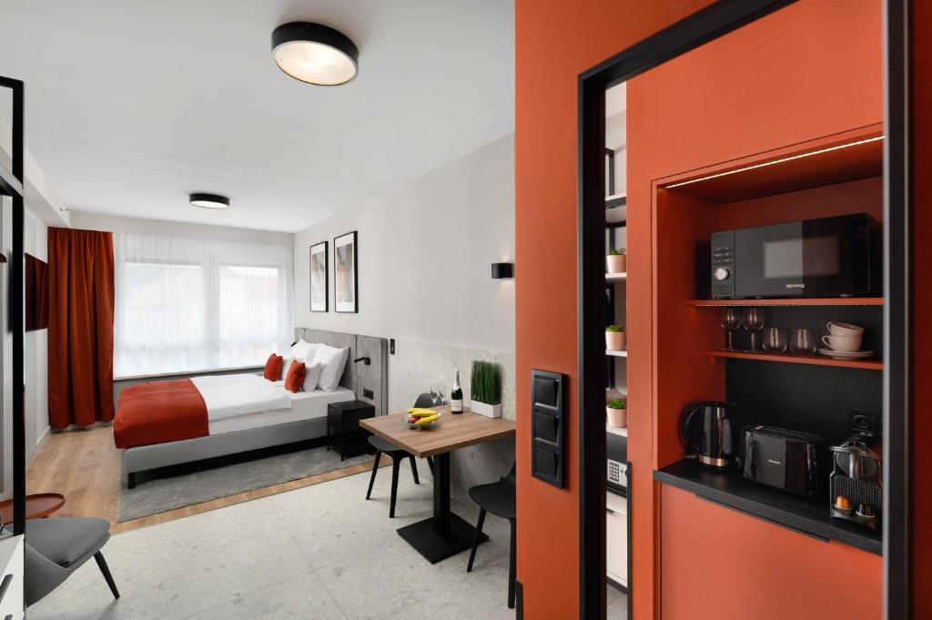 Postel nebo postele na pokoji v ubytování Florin Apart Hotel
