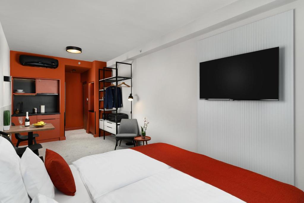 TV a/nebo společenská místnost v ubytování Florin Apart Hotel