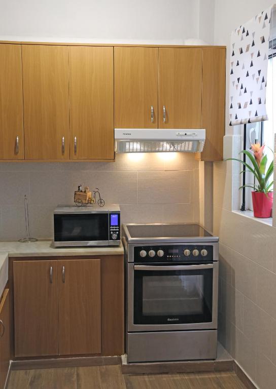 Kuchyňa alebo kuchynka v ubytovaní Sitia Cozy Apartment