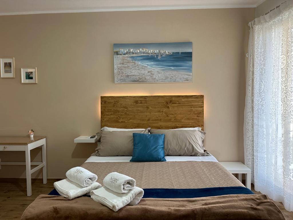 Postel nebo postele na pokoji v ubytování Nicarè Rooms