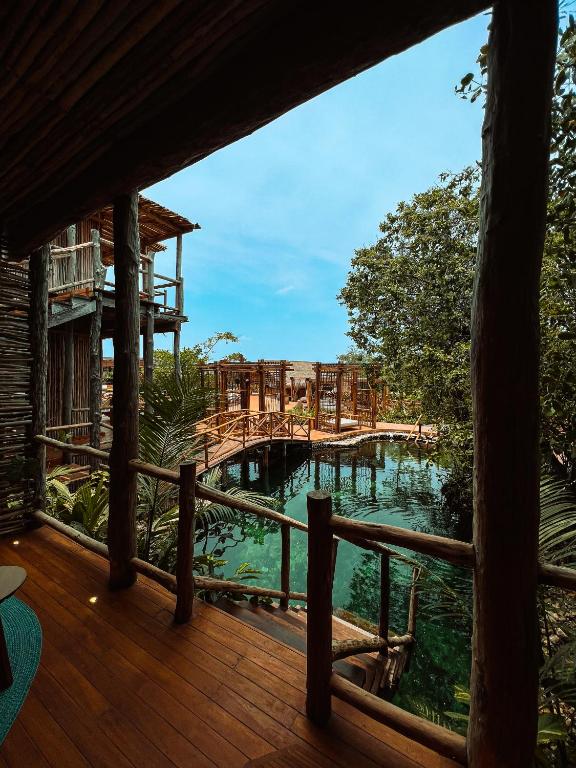 a view from the deck of a resort with a playground at Hotel Shibari - Restaurant & Cenote Club in Tulum
