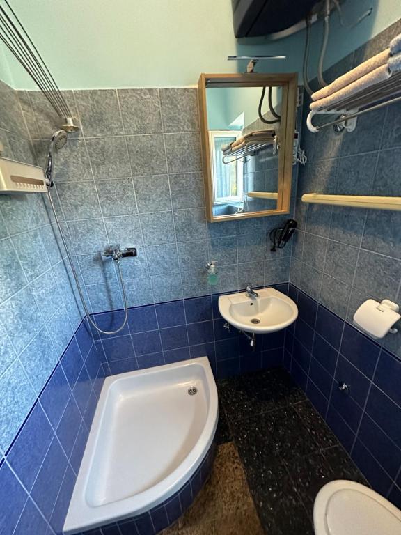 Koupelna v ubytování Apartments Armin