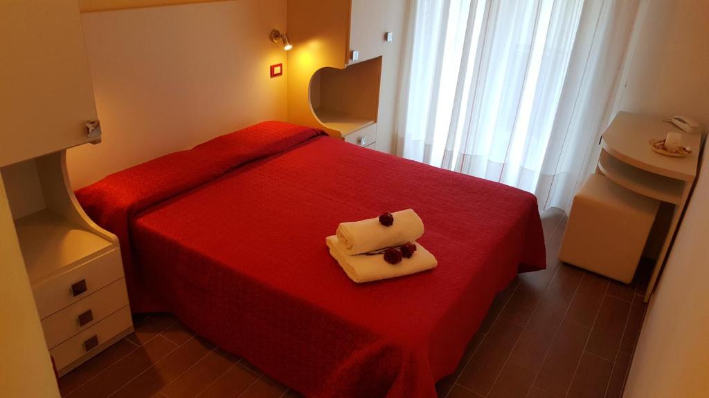 Łóżko lub łóżka w pokoju w obiekcie Hotel Perla Verde