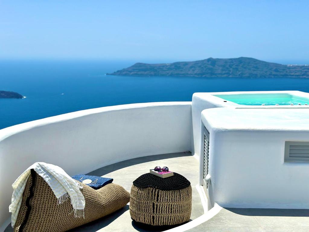 a pair of shoes sitting on the side of a boat at Eteoro Suites in Imerovigli