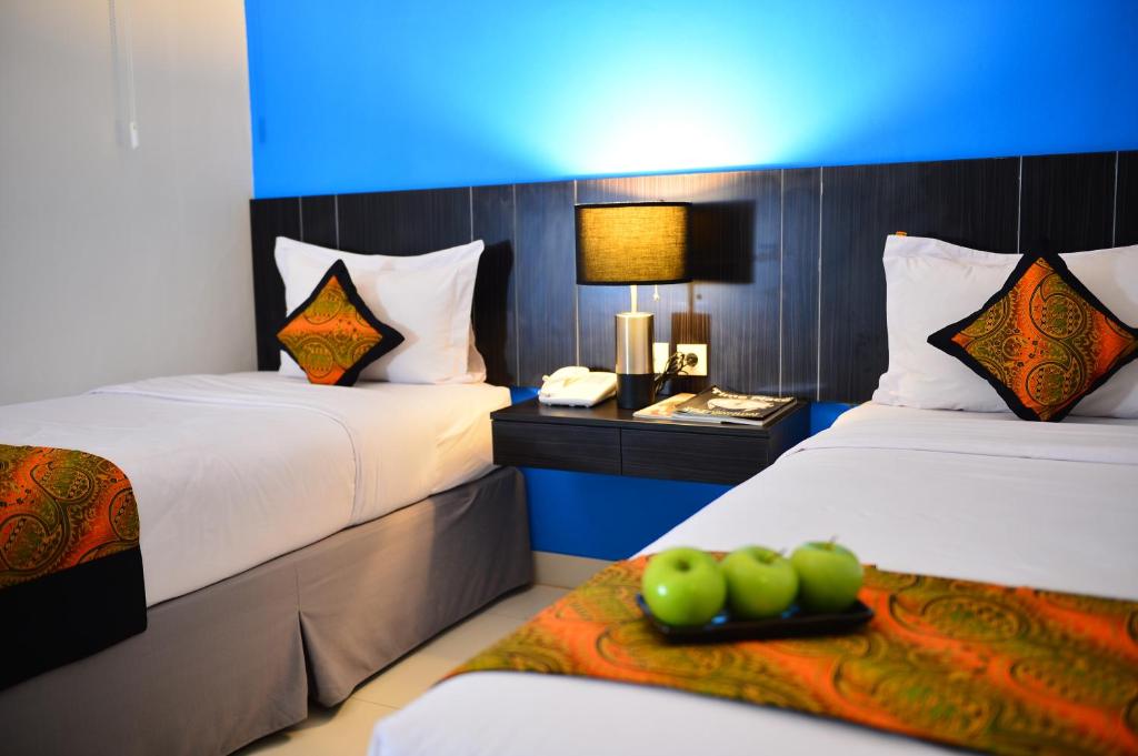 Postel nebo postele na pokoji v ubytování J Hotel - Bandara Soekarno Hatta