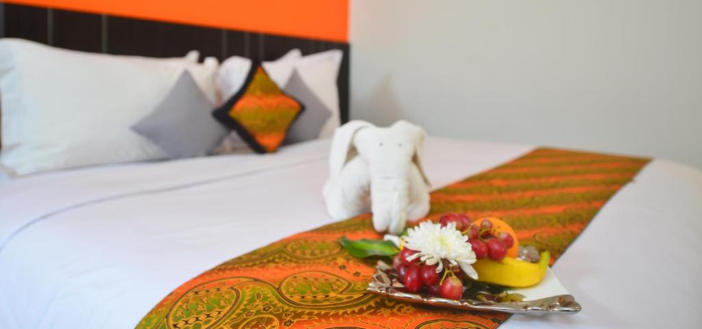 Postel nebo postele na pokoji v ubytování J Hotel - Bandara Soekarno Hatta