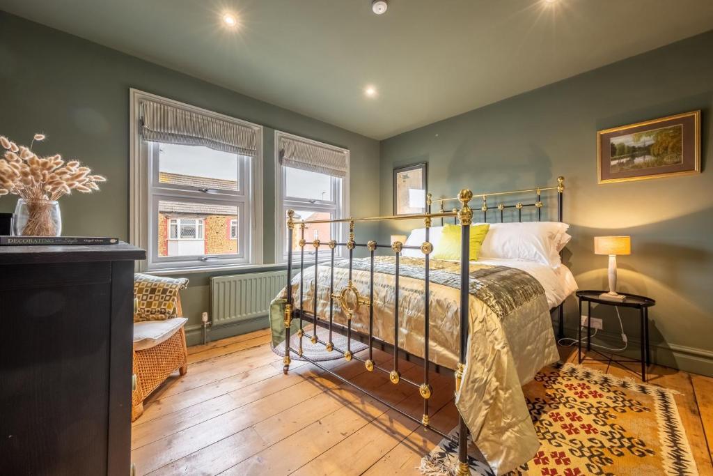 Postel nebo postele na pokoji v ubytování Norfolk House