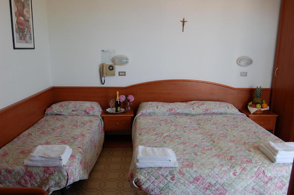 Postel nebo postele na pokoji v ubytování Hotel Villa Verde