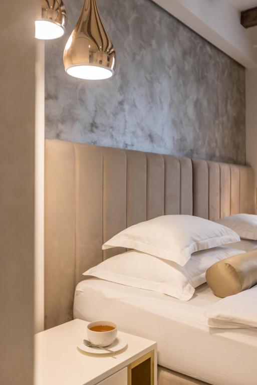 Postel nebo postele na pokoji v ubytování Sperone Hotel