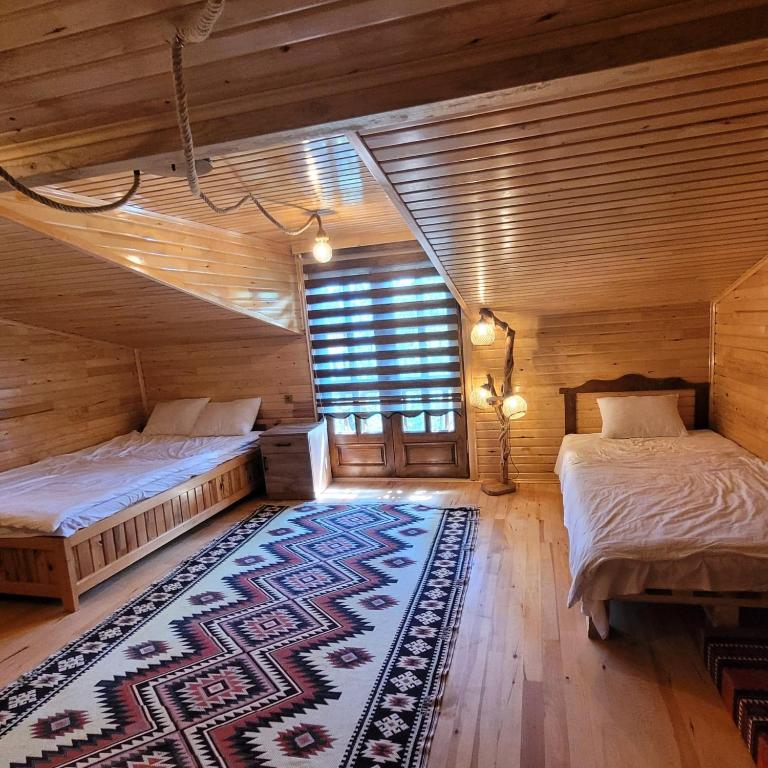 A bed or beds in a room at Selin Yaşam Evi