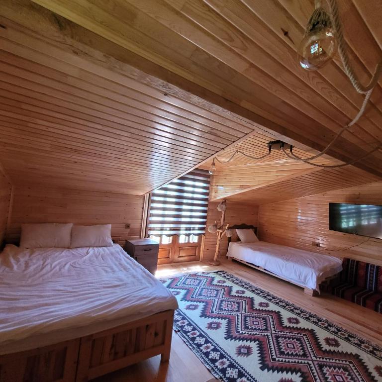 A bed or beds in a room at Selin Yaşam Evi