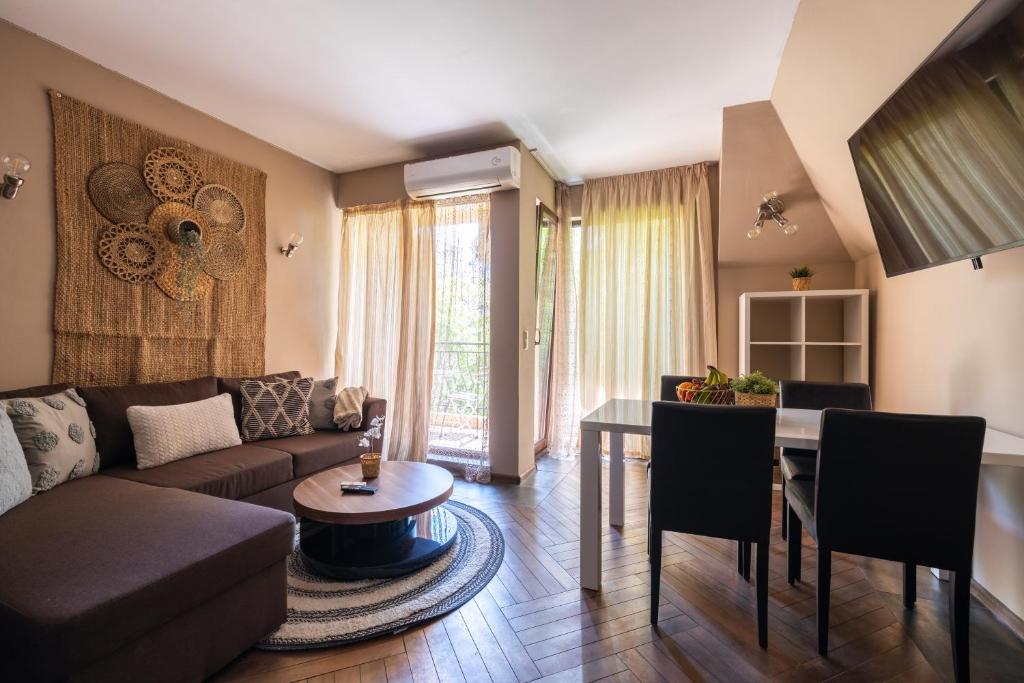 a living room with a couch and a table at Quiet & Modern Maisonette in Varna City